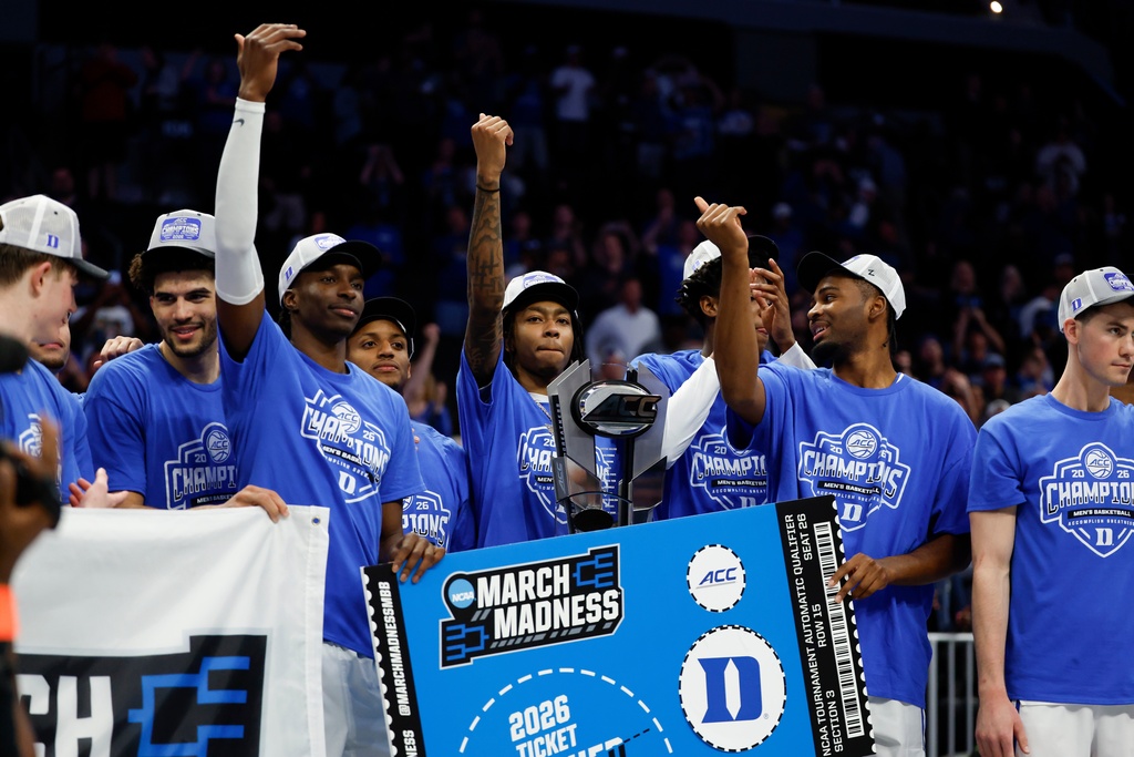 Duke celebrates winning the championship of the Atlantic Coast Conference tournament in an NCAA college basketball game in Charlotte, N.C., Saturday, March 14, 2026. (AP Photo/Nell Redmond)