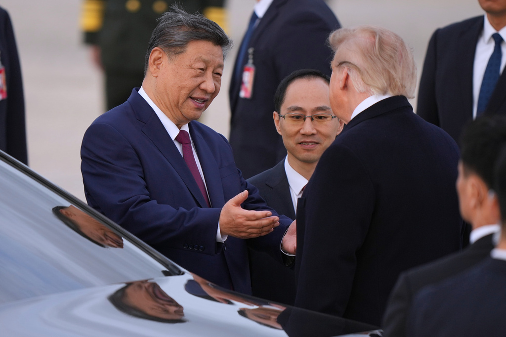 President Donald Trump and Chinese President Xi Jinping talk together at Joint Base Andrews, Md., Wednesday, Sept. 23, 2026. (AP Photo/Mark Schiefelbein)