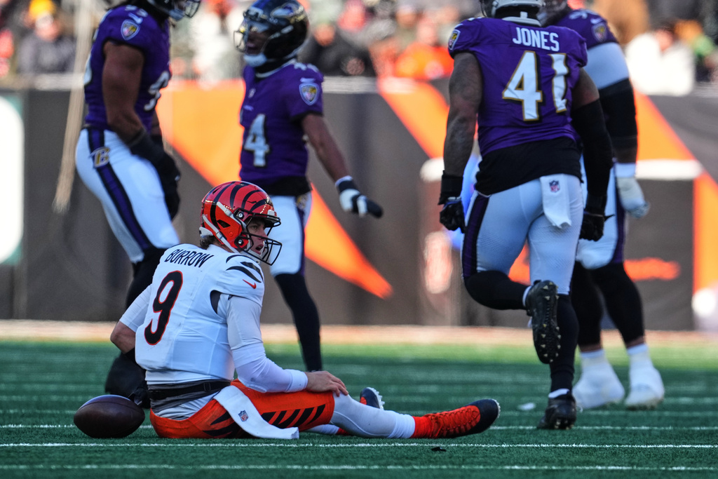 Cincinnati Bengals quarterback Joe Burrow (9) reacts after being sacked by Baltimore Ravens linebacker Tavius Robinson during the first half of an NFL football game, Sunday, Dec. 14, 2025, in Cincinnati. (AP Photo/Jeff Dean)