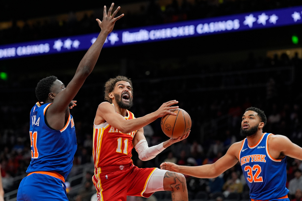 Atlanta Hawks guard Trae Young (11) shoots against New York Knicks forward Mohamed Diawara (51) during the first half of an NBA basketball game, Saturday, Dec. 27, 2025, in Atlanta. (AP Photo/Mike Stewart)