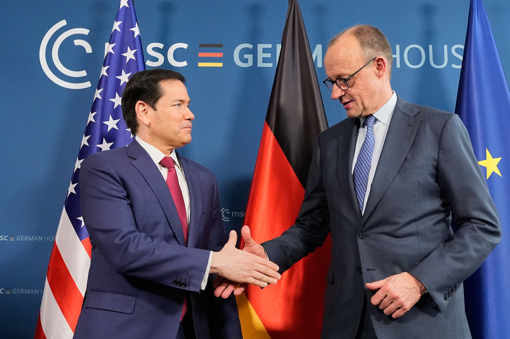 U.S. Secretary of State Marco Rubio, left, and Germany's Chancellor Friedrich Merz shake hands in Munich, Germany, Friday, Feb. 13, 2026, at the the Munich Security Conference. (AP Photo/Alex Brandon, Pool)