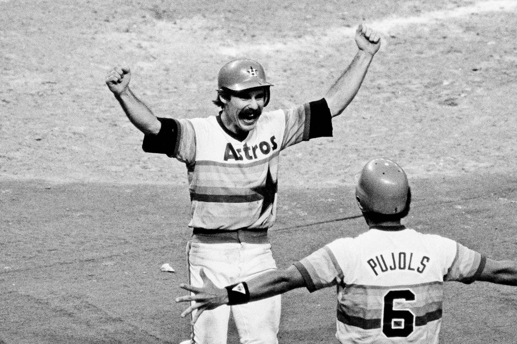 FILE - Houston Astros' Phil Garner is greeted by Luis Pujols as he scores the winning run from third to defeat the Los Angeles Dodgers 1-0 in the 11th inning of Game 2 of the National League West playoffs at Houston, Oct. 7, 1981. (AP Photo/F. Carter Smith, File)