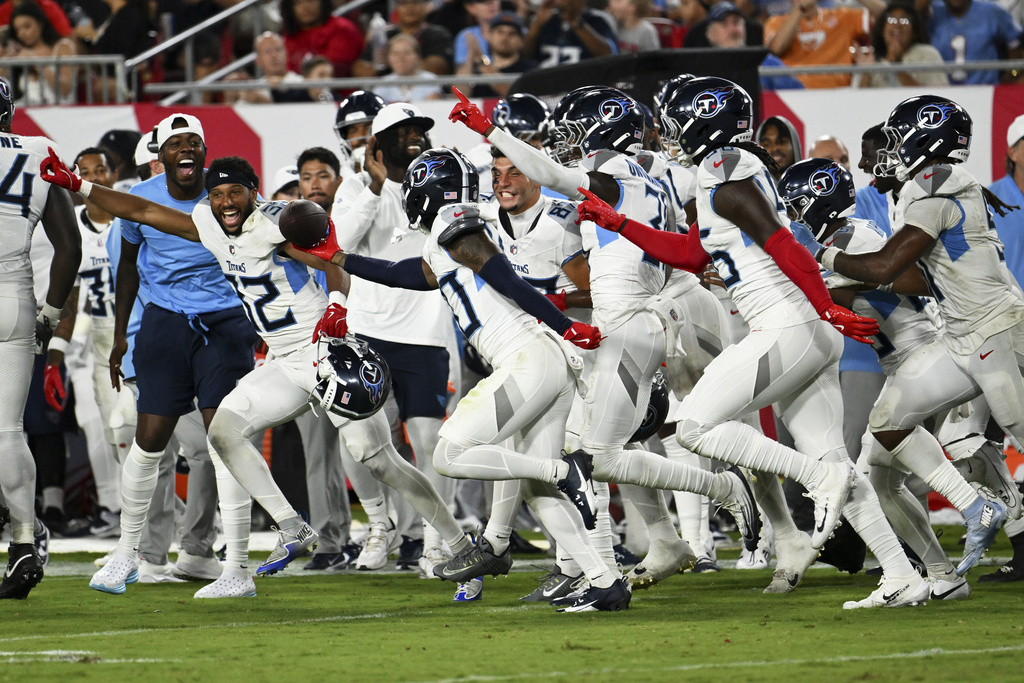 Tennessee Titans cornerback Davion Ross celebrates after recovering a fumble Tampa Bay Buccaneers during the second half of an NFL preseason football game on Saturday, Aug. 9, 2025, in Tampa, Fla. (AP Photo/Jason Behnken)