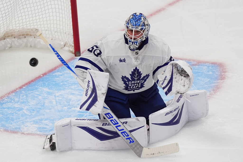 Toronto Maple Leafs goaltender Joseph Woll deflects a shot in the first period of an NHL hockey game against the Colorado Avalanche, Monday, Jan. 12, 2026, in Denver. (AP Photo/David Zalubowski)