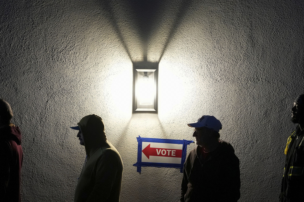 FILE - Voters stand in line outside a polling place at Madison Church, Nov. 5, 2024, in Phoenix, Ariz. (AP Photo/Matt York)
