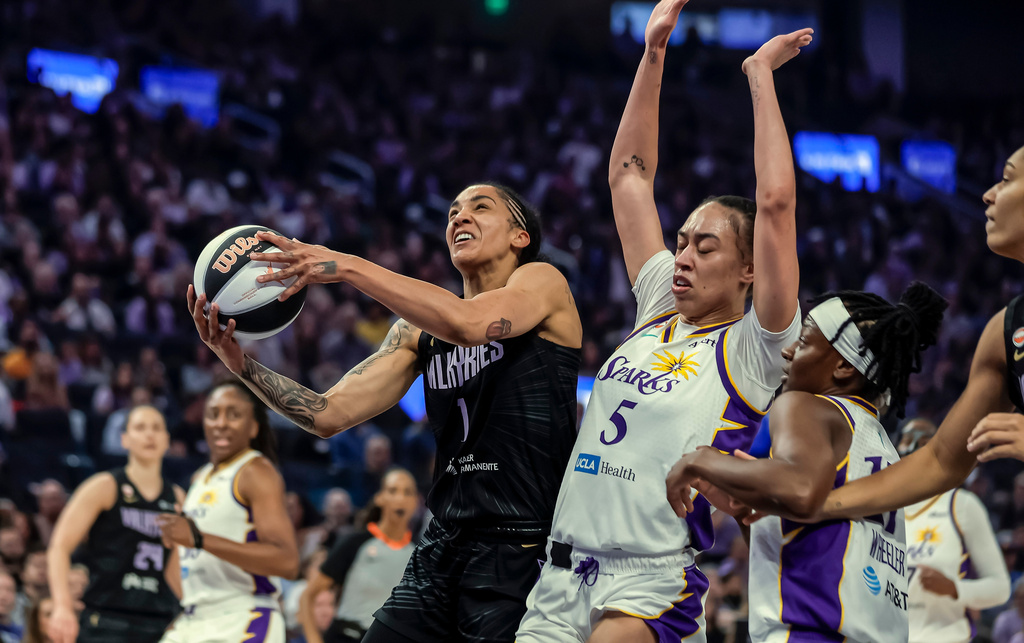 Golden State Valkyries' Gabby Williams (1) drives to the basket in the first half of a WNBA basketball game against the Los Angeles Sparks, Monday, June 15, 2026, in San Francisco. (Carlos Avila Gonzalez/San Francisco Chronicle via AP)