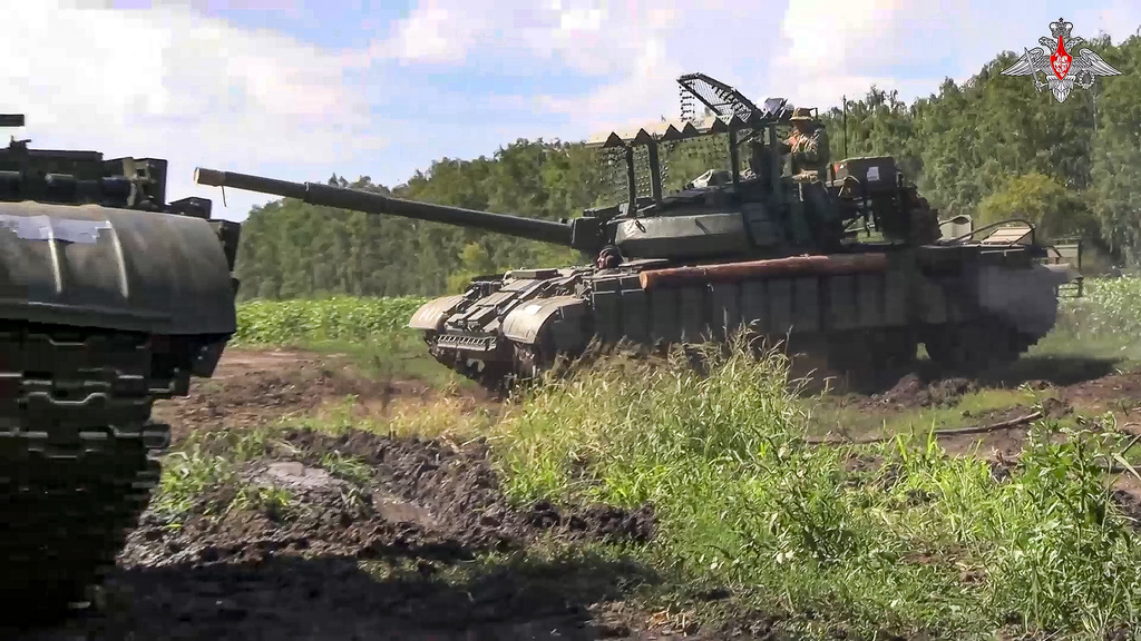 In this photo taken from video released by the Russian Defense Ministry on Saturday, Aug. 10, 2024, Russian Army tanks take a position at an area of Kursk region of Russia. (Russian Defense Ministry Press Service via AP)