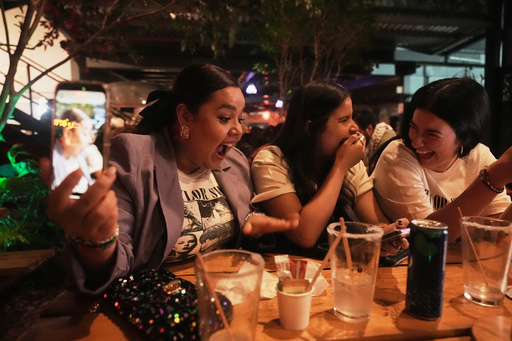 Fans gather to celebrate the release of Taylor Swift's new album, "The Life of a Showgirl" in Mexico City, Thursday, Oct. 2, 2025. (AP Photo/Claudia Rosel) Fans gather to celebrate the release of Taylor Swift's new album, "The Life of a Showgirl" in Mexico City, Thursday, Oct. 2, 2025. (AP Photo/Claudia Rosel)