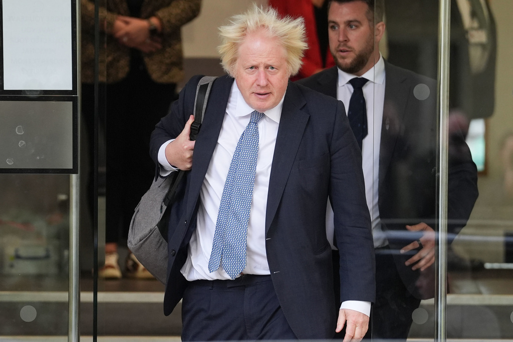 Former prime minister Boris Johnson leaves Dorland House in London after giving evidence for module 8 (children and young people) in the UK Covid-19 Inquiry, on Tuesday Oct. 21, 2025. (Lucy North/PA via AP)
