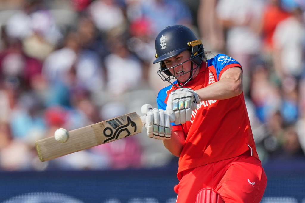 England's Natalie Sciver-Brunt, hits runs during the Women's T20 Cricket World Cup final between England and Australia in London, Sunday, July 5, 2026. (AP Photo/Alastair Grant)