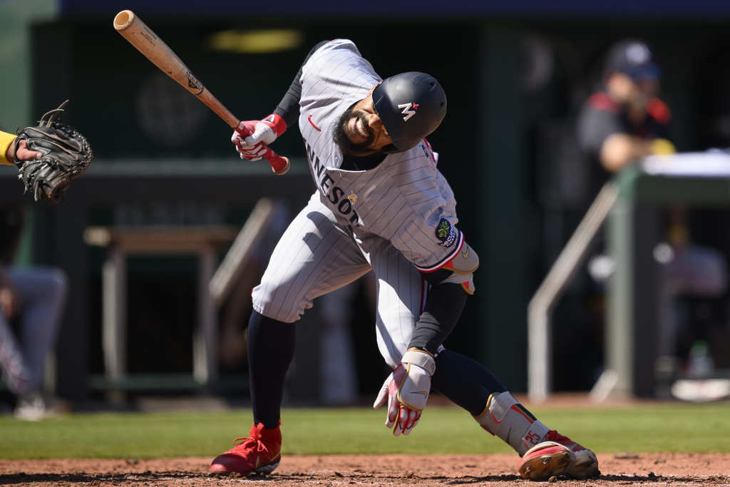 Minnesota Twins' Byron Buxton reacts after being hit by a pitch during the fifth inning of a baseball game against the Kansas City Royals in Kansas City, Mo., Sunday, Sept. 7, 2025. (AP Photo/Reed Hoffmann)