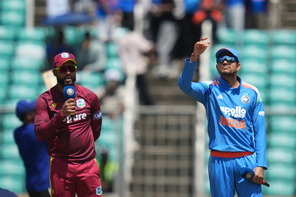 India's captain Shubman Gill, right, toss the coin as West Indies' captain Shai Hope looks on during the first one day international cricket match between India and West Indies in Thiruvananthapuram, India, Sunday, Sept. 27, 2026. (AP Photo/ Rafiq Maqbool)