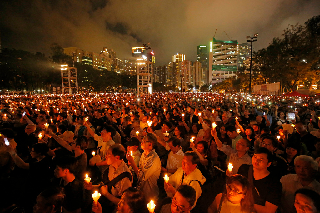 FILE - Thousands of people attend a candlelight vigil for victims of the Beijing's 1989 brutal military crackdown on protesters at Victoria Park in Hong Kong, on June 4, 2019. (AP Photo/Kin Cheung, File)