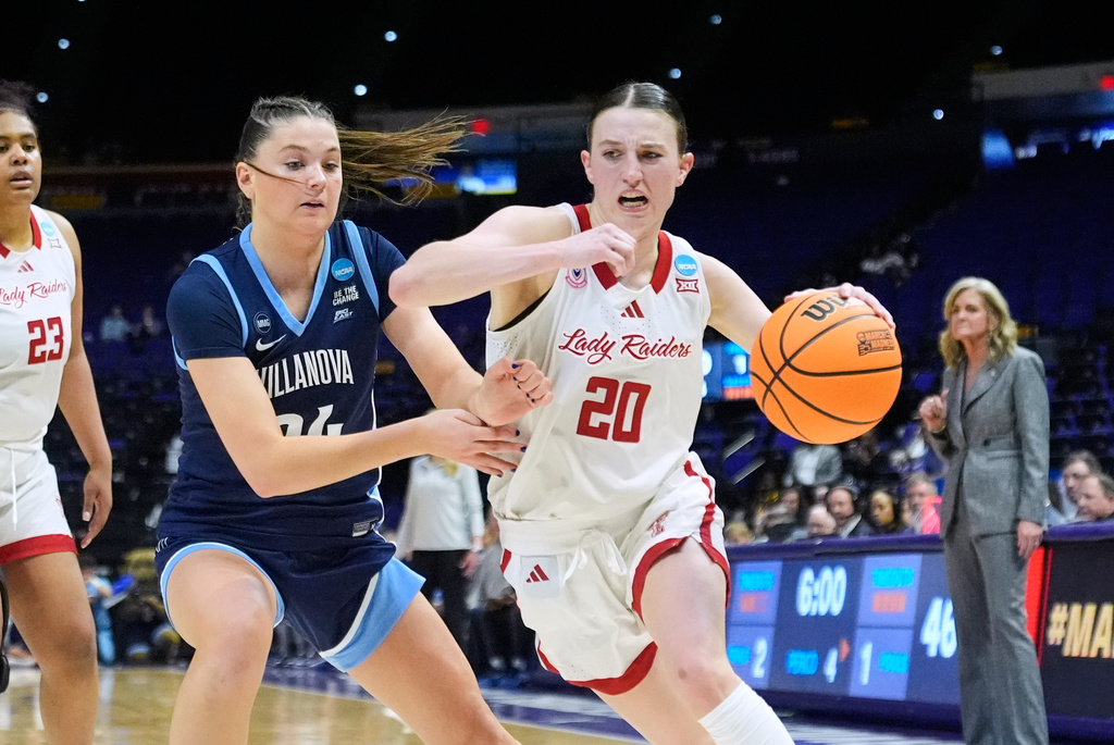 Texas Tech guard Bailey Maupin (20) drives to the basket past Villanova guard Dani Ceseretti (24) during the second half in the first round of the NCAA college basketball tournament, Friday, March 20, 2026, in Baton Rouge, La. (AP Photo/Gerald Herbert)