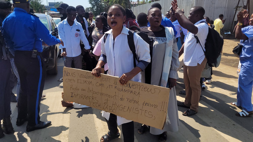 Health workers at the epicenter of the Ebola outbreak protest over unpaid wages at the provincial governor's office in Ituri, eastern Congo, Thursday, Aug. 6, 2026. (AP Photo/Constant Same Bagalwa)