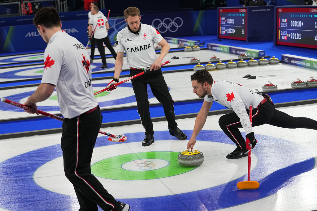 Canada's Brett Gallant, Marc Kennedy and Tyler Tardi in action during the men's curling round robin session against Norway at the 2026 Winter Olympics, in Cortina d'Ampezzo, Italy, Thursday, Feb. 19, 2026. (AP Photo/Fatima Shbair)