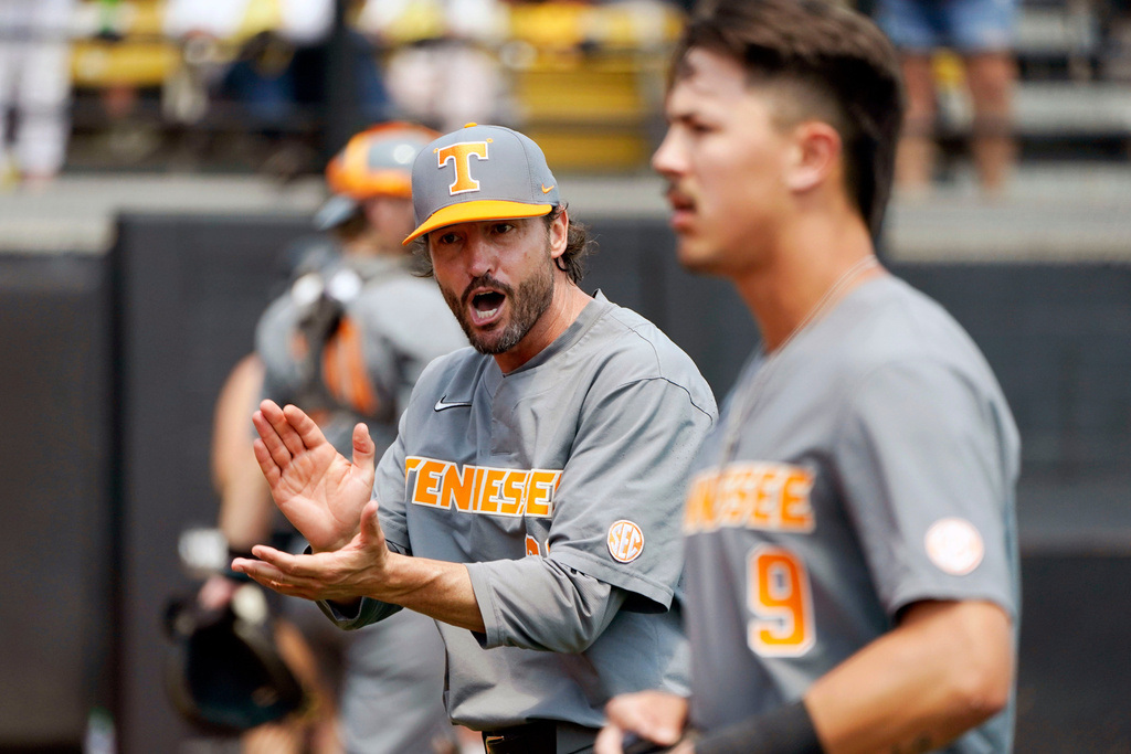 FILE - Tennessee coach Tony Vitello, left, cheers on his players in the fifth inning of an NCAA college baseball tournament super regional game against Southern Mississippi, Sunday, June 11, 2023, in Hattiesburg, Miss. (AP Photo/Rogelio V. Solis, File)