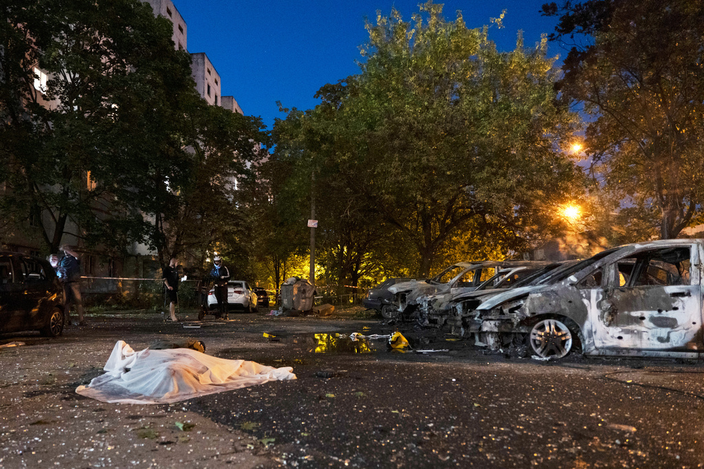 A body lies on the ground after a Russian missile attack in Kyiv, Ukraine, Saturday, Aug. 1, 2026. (AP Photo/Dan Bashakov)