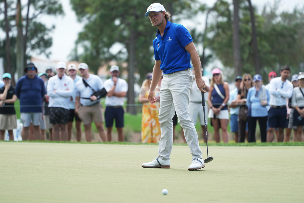 Austin Smotherman reacts to his putt on the eighth green during the third round of the Cognizant Classic golf tournament, Saturday, Feb. 28, 2026, in Palm Beach Gardens, Fla. (AP Photo/Marta Lavandier)