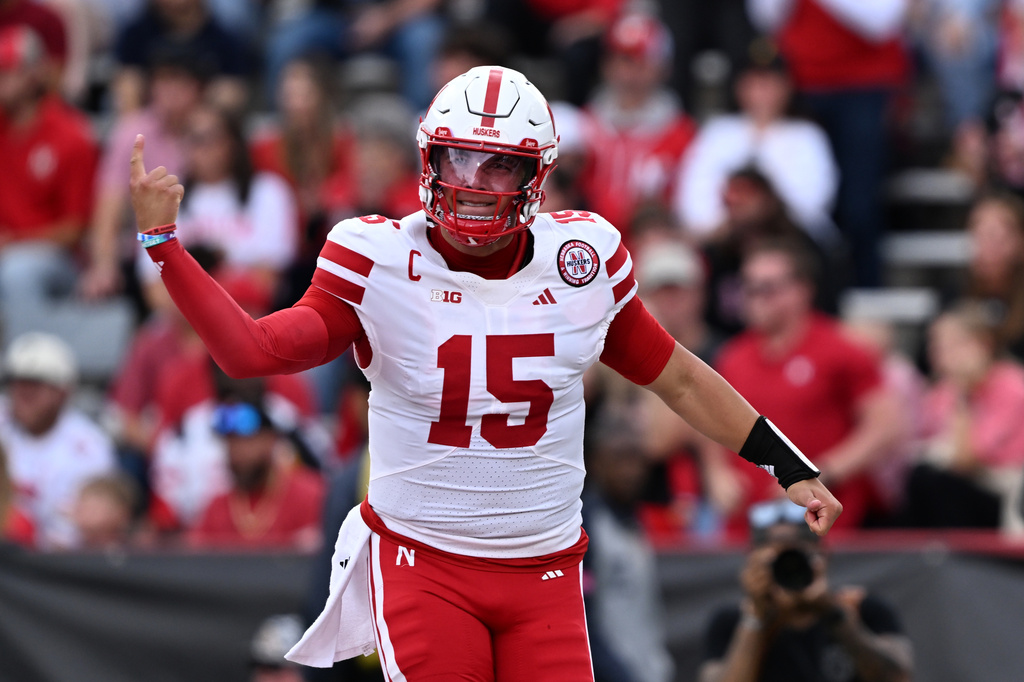 Nebraska quarterback Dylan Raiola (15 ) reacts after throwing a a pass for a touchdown against Maryland during the first half of a NCAA college football game, Saturday, Oct. 11, 2025, in College Park, Md. (AP Photo/Gail Burton)