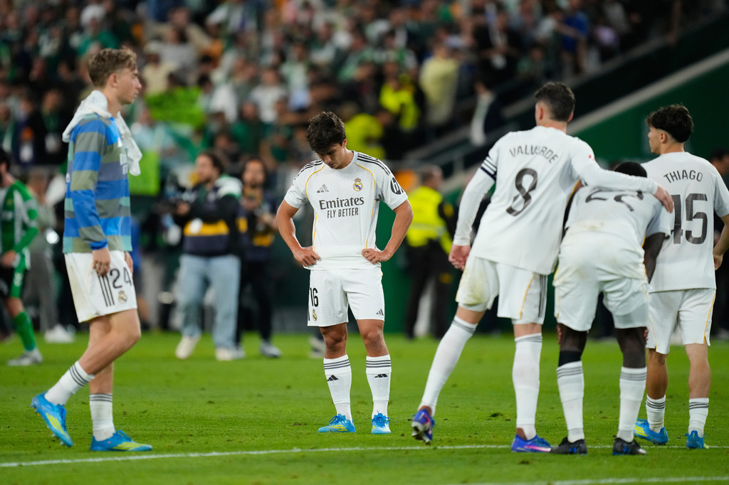 Real Madrid players stand dejected after a La Liga soccer match between Real Betis and Real Madrid in Seville, Spain, Friday, April 24, 2026. (AP Photo/Jose Breton)