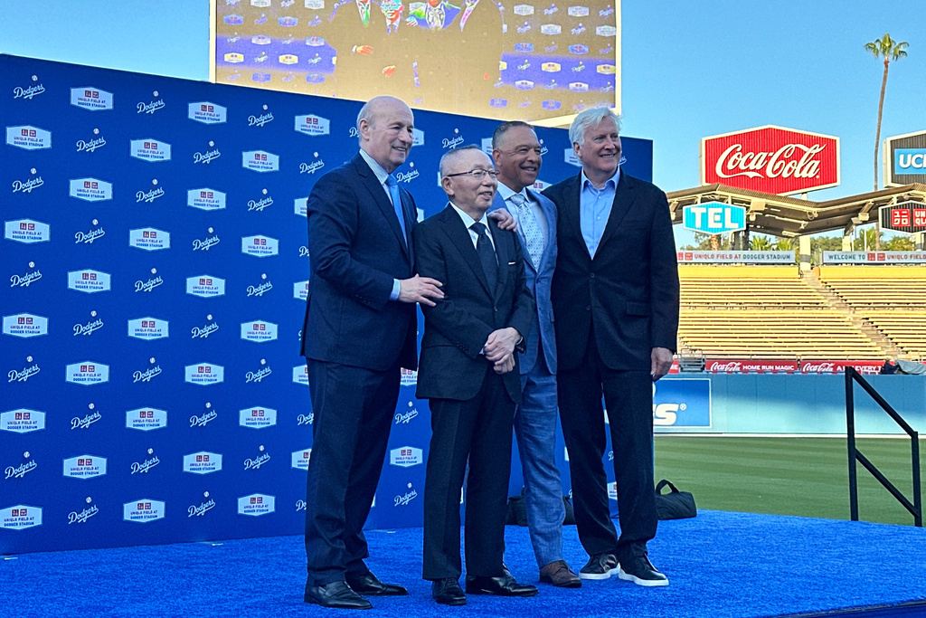 Dodgers executive Stan Kasten, Uniqlo chairman Tadashi Yanai, Dodgers manager Dave Roberts and Team owner Mark Walter pose for a photo at the Uniqlo Field unveiling Wednesday, March 25, 2026, at the Dodgers Stadium in Los Angeles. (AP Photo/Beth Harris)