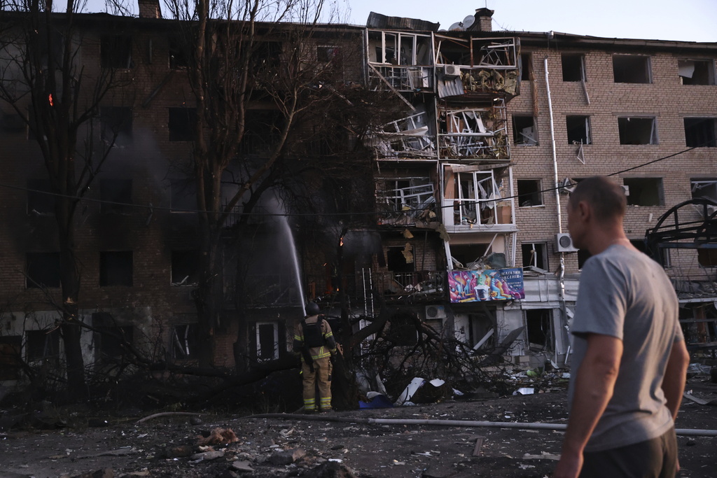 A resident looks at his destroyed home following Russian air strike in Zaporizhzhia, Ukraine, Saturday, Aug. 30, 2025. (AP Photo/Kateryna Klochko)