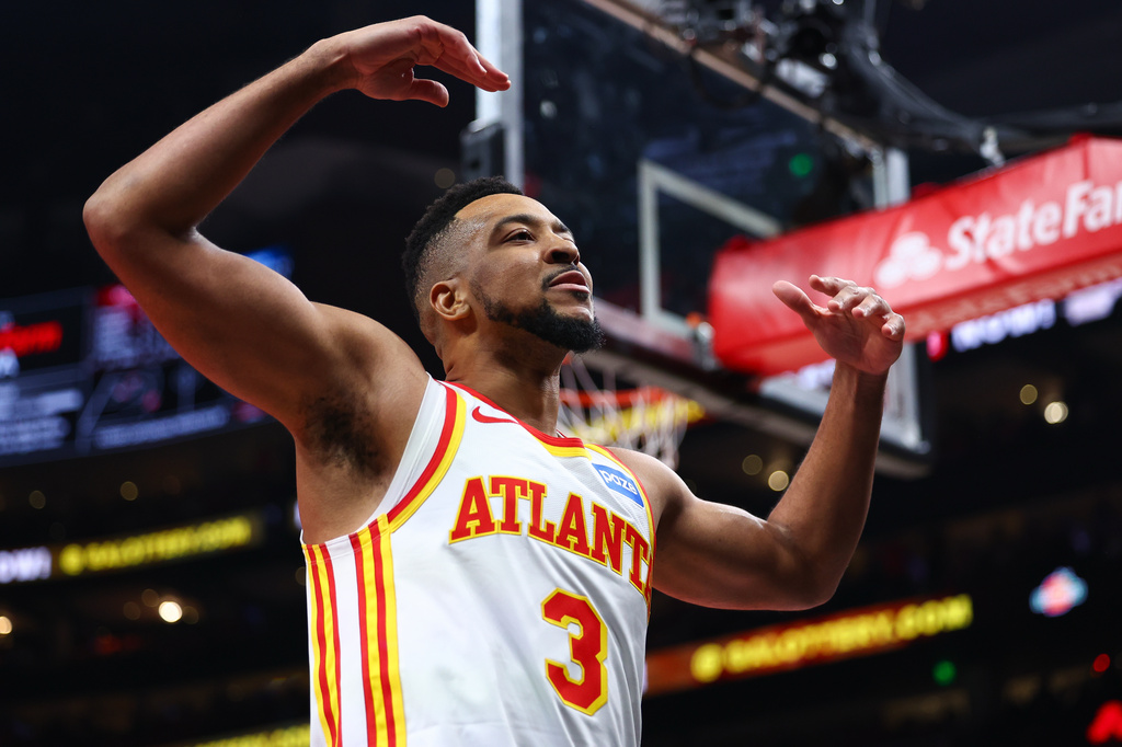 Atlanta Hawks guard CJ McCollum (3) reacts to the crowd during the first half in Game 3 of a first-round NBA playoffs basketball series against the New York Knicks, Thursday, April 23, 2026, in Atlanta. (AP Photo/Colin Hubbard)