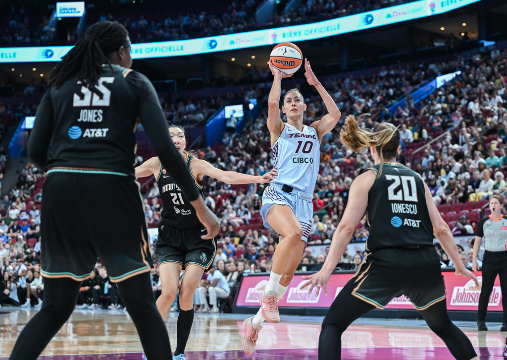 Toronto Tempo's Maria Conde (10) looks to shoot in the paint during the first half of a WNBA basketball game against the New York Liberty in Montreal, Sunday, July 12, 2026. (Graham Hughes/The Canadian Press via AP)
