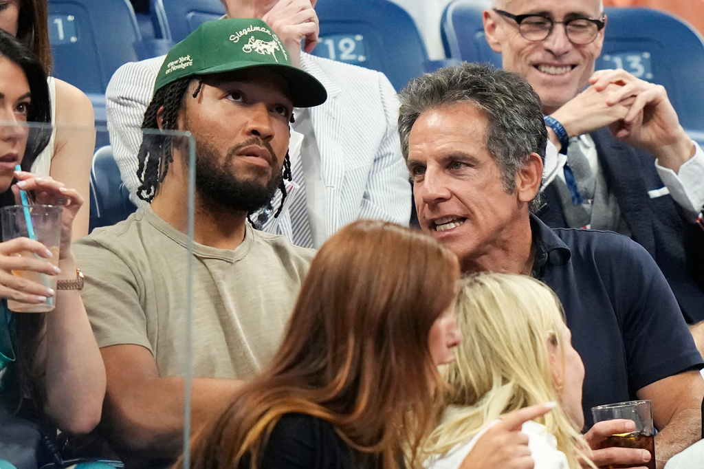 New York Knicks' Jalen Brunson and Actor Ben Stiller, right, talk while attending a match between Ben Shelton, of the United States, and Frances Tiafoe, of the United States, during the men's singles semifinals of the U.S. Open tennis championships Friday, Sept. 11, 2026, in New York. (AP Photo/Frank Franklin II)
