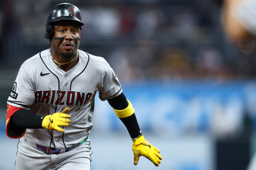 Arizona Diamondbacks' Geraldo Perdomo runs to third base after hitting an RBI triple in the first inning of a baseball game against the San Diego Padres, Friday, Sept. 25, 2026, in San Diego. (AP Photo/Karl Anderson)