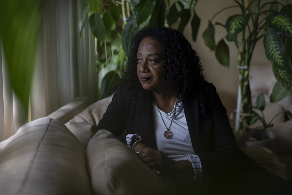 Delphine Cherry looks out from her favorite spot in her home Friday, Sept. 5, 2025, in Hazel Crest, Ill. (AP Photo/Carolyn Kaster)