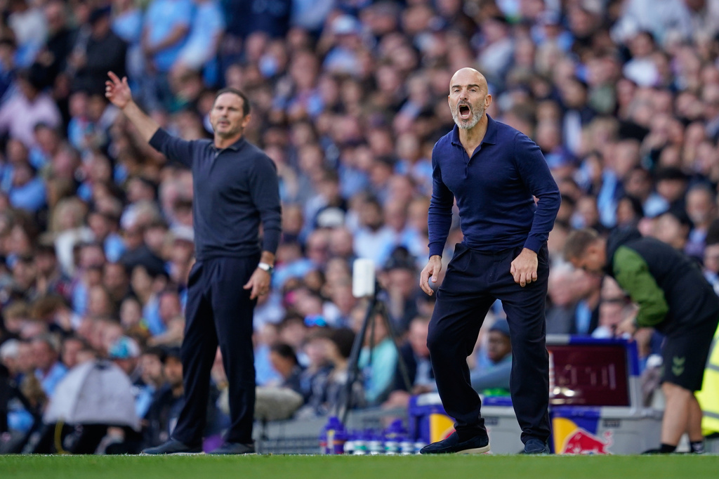 Manchester City's head coach Enzo Maresca, right, and Coventry City's head coach Frank Lampard react during the English Premier League soccer match between Manchester City and Coventry City in Manchester, England, Saturday, Sept. 5, 2026. (AP Photo/Dave Thompson)
