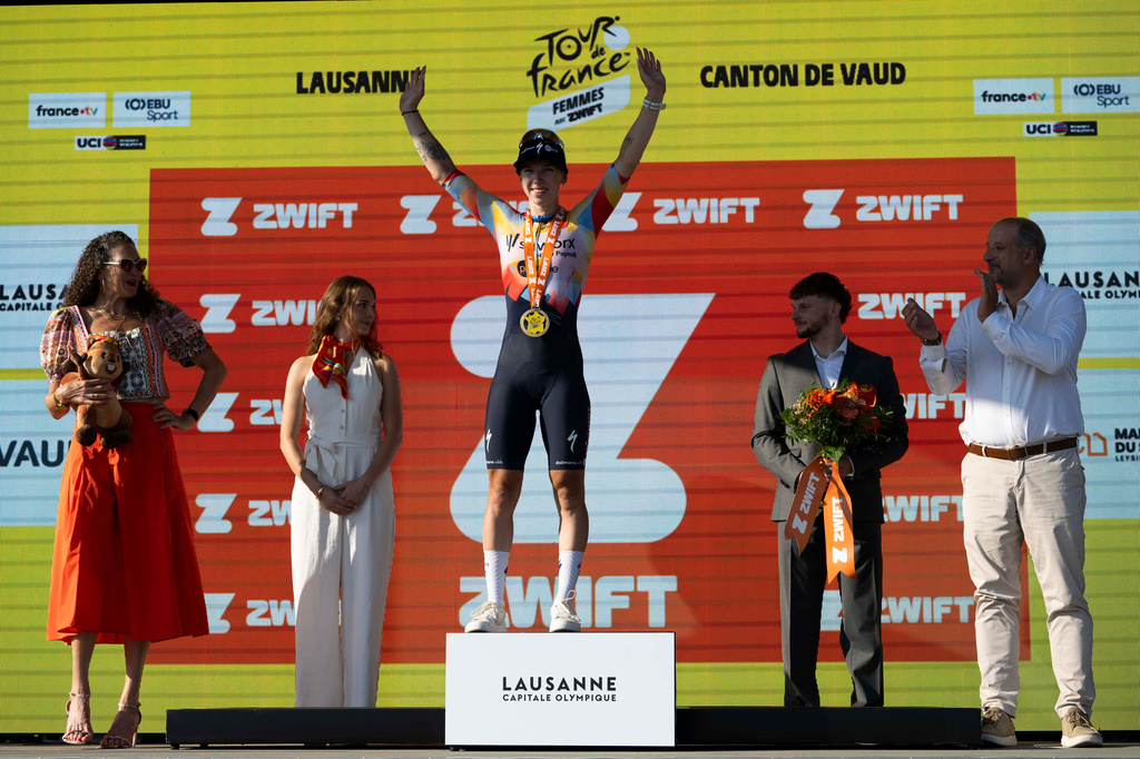 Netherlands' Lorena Wiebes of team SD Worx Protime celebrates on the podium after winning the first stage of the Women's Tour de France cycling race (Tour de France Femmes), in Lausanne, Switzerland, Saturday, Aug. 1, 2026. (Jean-Christophe Bott/Keystone via AP)