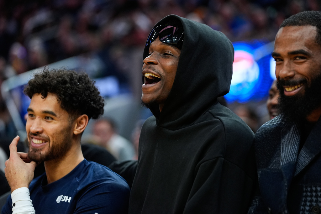Minnesota Timberwolves guard Anthony Edwards, center, reacts from the bench during the second half of an NBA basketball game against the Golden State Warriors, Friday, Dec. 12, 2025, in San Francisco. (AP Photo/Godofredo A. Vásquez)
