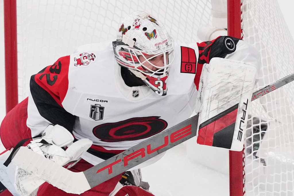 Carolina Hurricanes goaltender Brandon Bussi (32) stops a shot on goal during the first period in Game 6 of the NHL hockey Stanley Cup Final series against the Vegas Golden Knights, Sunday, June 14, 2026, in Las Vegas. (AP Photo/Candice Ward)