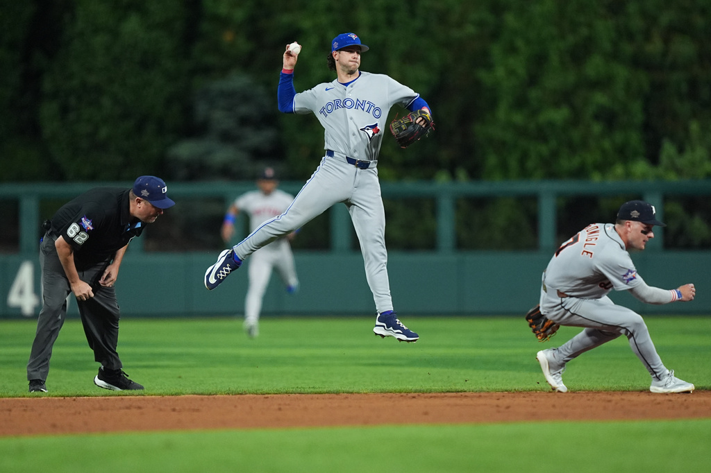 Toronto Blue Jays' Ernie Clement throws to first for an out by Los Angeles Dodgers' Andy Pages in the fifth inning during the MLB baseball All-Star Game between the American League and National League, Tuesday, July 14, 2026, in Philadelphia. (AP Photo/Matt Rourke)