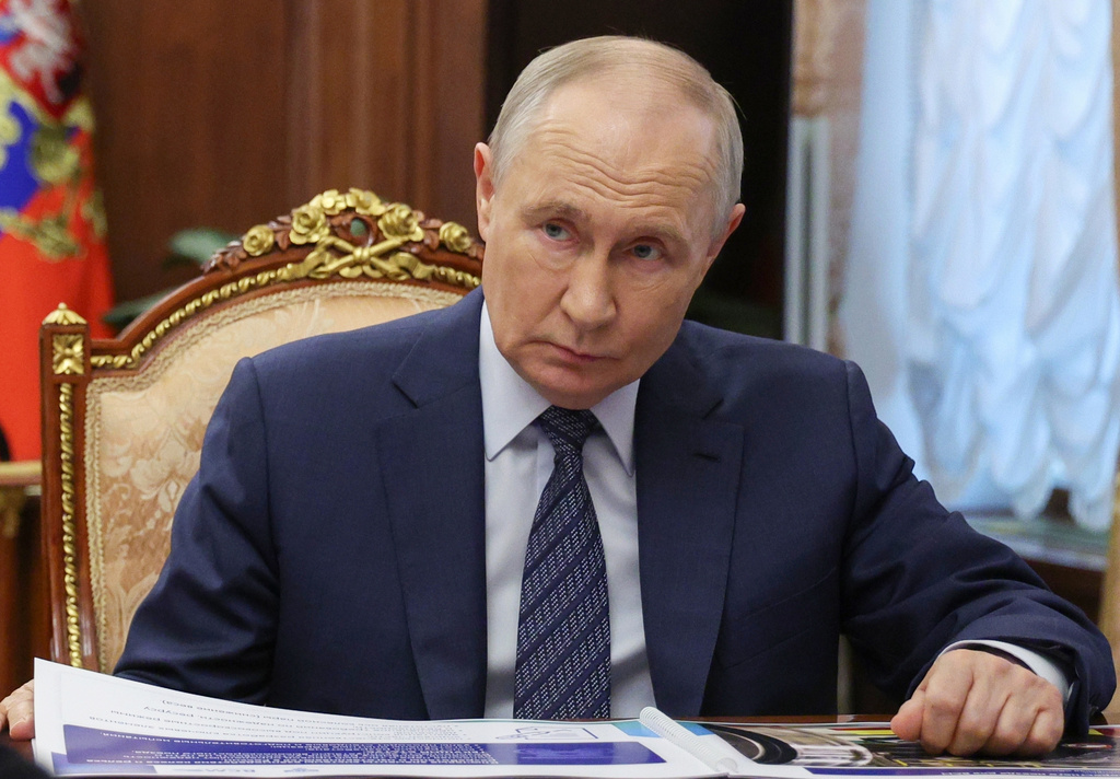 Russian President Vladimir Putin listens to Transport Minister Andrey Nikitin during their meeting at the Kremlin in Moscow, Monday, June 15, 2026. (Vyacheslav Prokofyev, Sputnik, Kremlin Pool Photo via AP)