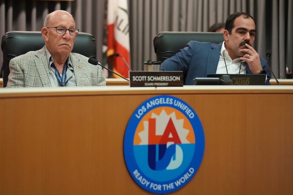 Los Angeles Unified School District board President Scott Schmerelson, left, and Executive Officer of the Board of Education Michael McLean listen to public comments during a meeting at LAUSD headquarters before a special closed session with Superintendent Alberto Carvalho, Thursday, Feb. 26, 2026, in Los Angeles. (AP Photo/Damian Dovarganes)
