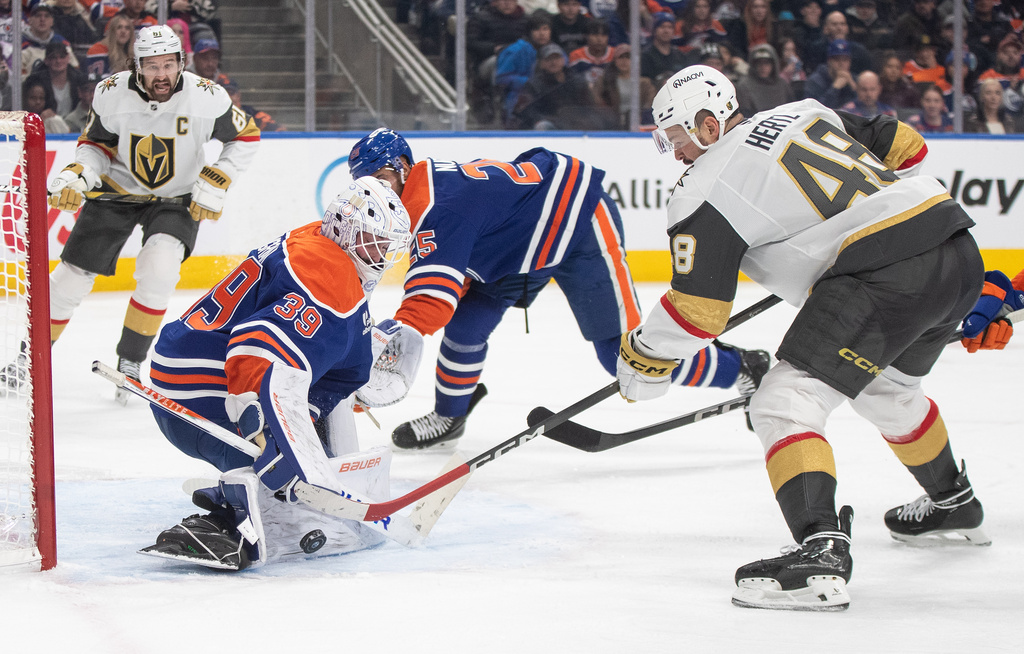 Vegas Golden Knights' Tomas Hertl (48) is stopped by Edmonton Oilers goalie Connor Ingram (39) during third-period NHL hockey game action in Edmonton, Alberta, Sunday, Dec. 21, 2025. (Jason Franson/The Canadian Press via AP)