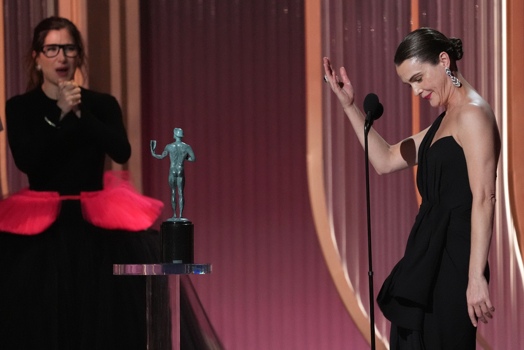 Keri Russell accepts the award for outstanding performance by a female actor in a drama series for "The Diplomat" during the 32nd Annual Actor Awards on Sunday, March 1, 2026, at the Shrine Auditorium and Expo Hall in Los Angeles. Kathryn Hahn looks on from left.(AP Photo/Chris Pizzello)
