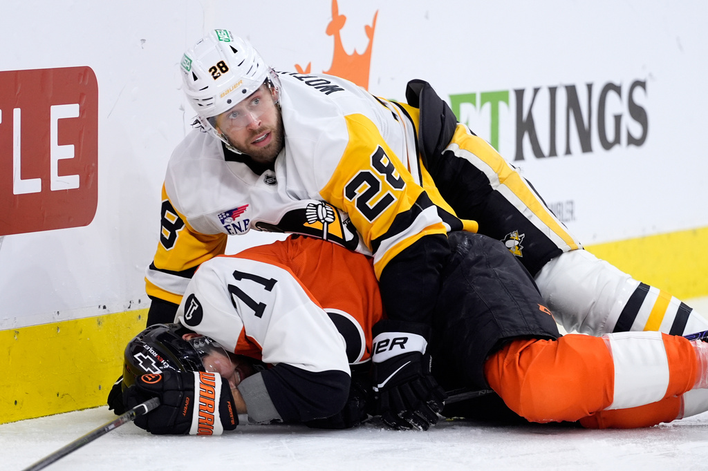 Pittsburgh Penguins' Parker Wotherspoon (28) collides with Philadelphia Flyers' Tyson Foerster (71) during the second period of Game 6 in the first round of the NHL hockey Stanley Cup playoffs series Wednesday, April 29, 2026, in Philadelphia. (AP Photo/Matt Slocum)
