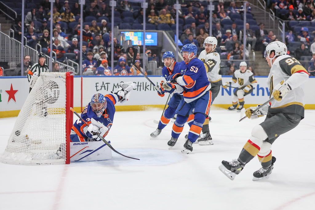 New York Islanders goaltender Ilya Sorokin (30) watches the puck go through the net after a goal by Vegas Golden Knights' Mitch Marner (93) during the first period of an NHL hockey game, Tuesday, Dec. 9, 2025, in Elmont, N.Y. (AP Photo/Heather Khalifa)