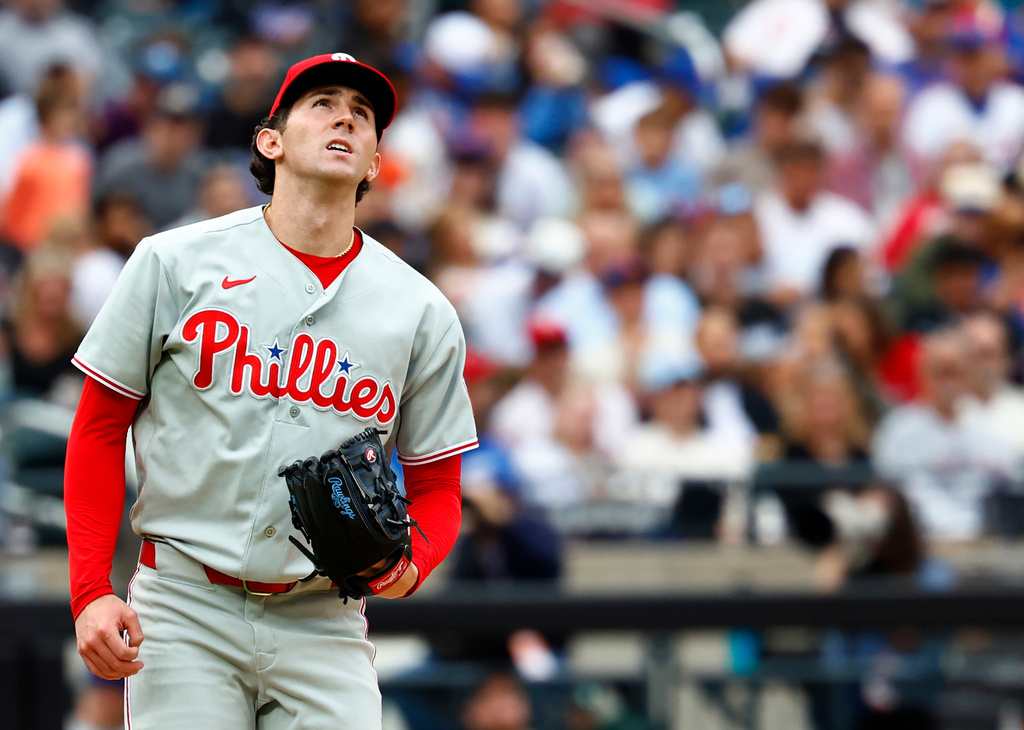 Philadelphia Phillies pitcher Andrew Painter reacts after giving up a home run to New York Mets' Carson Benge during the second inning of a baseball game, Saturday, Sept. 19, 2026, in New York. (AP Photo/Noah K. Murray)