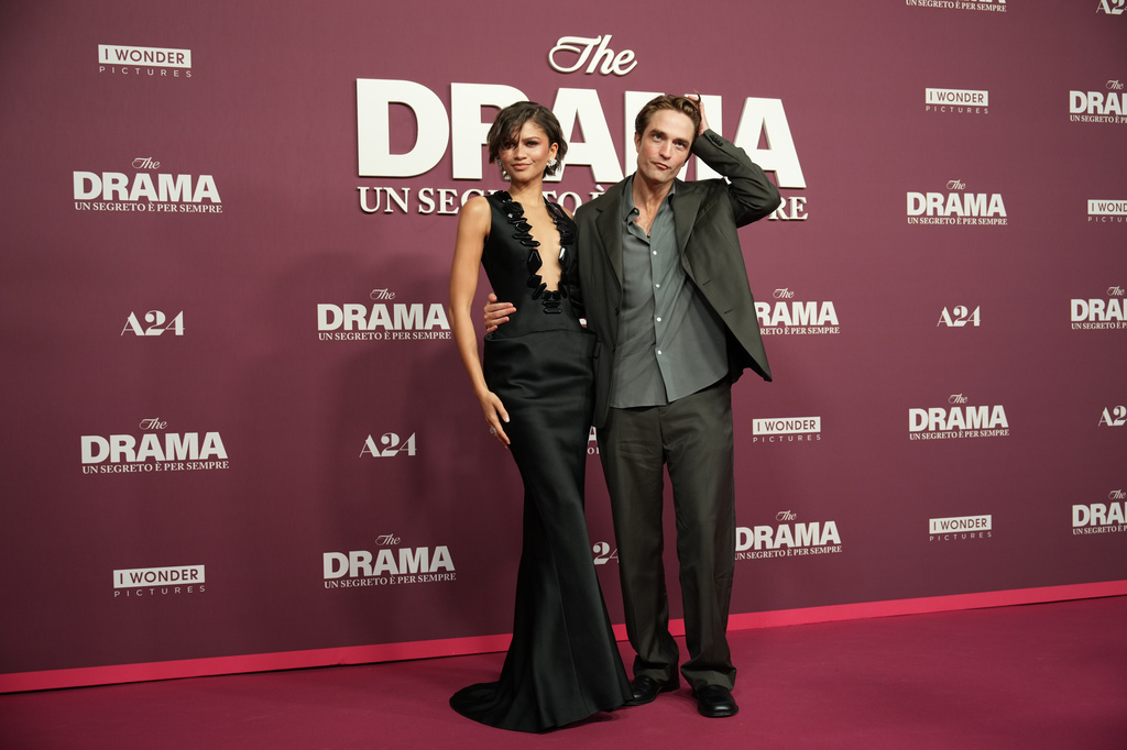 Actress Zendaya, left, and actor Robert Pattinson pose for photographers as they arrive for the Italian premiere of the movie "The Drama," in Rome, Thursday, March 26, 2026. (AP Photo/Andrew Medichini)