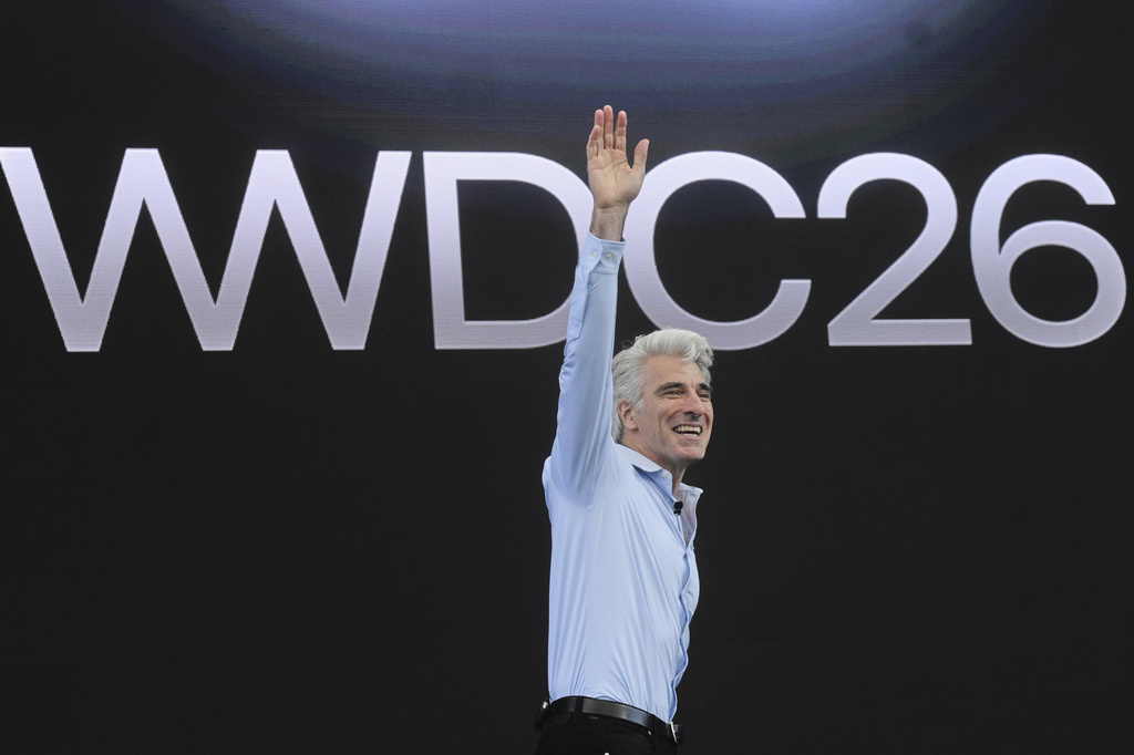 Craig Federighi, Apple's senior vice president of software engineering, waves during the annual World Wide Developers Conference at Apple's headquarters in Cupertino, Calif., Monday, June 8, 2026. (AP Photo/Noah Berger)
