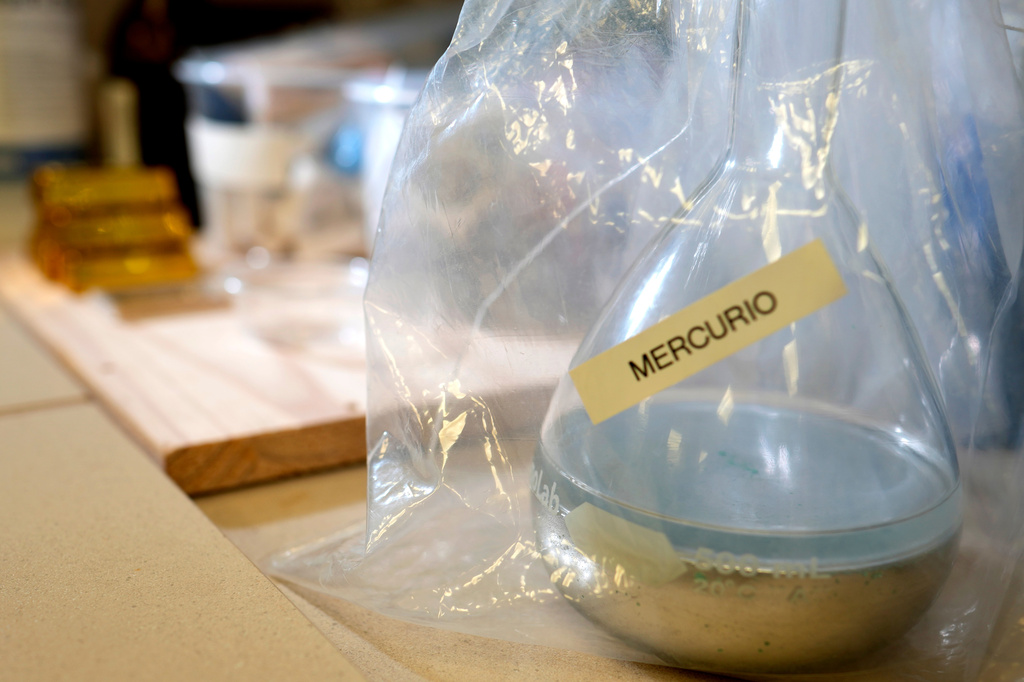 A laboratory container labeled mercury is visible at the National Institute of Criminalistics in Brasilia, Brazil, Monday, July 13, 2026. (AP Photo/Eraldo Peres)