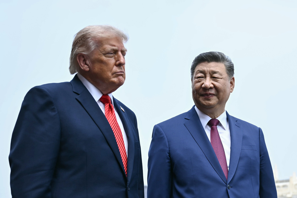 FILE - China's President Xi Jinping, right, and U.S. President Donald Trump visit the Temple of Heaven in Beijing, May 14, 2026. (Brendan Smialowski/Pool Photo via AP, File)