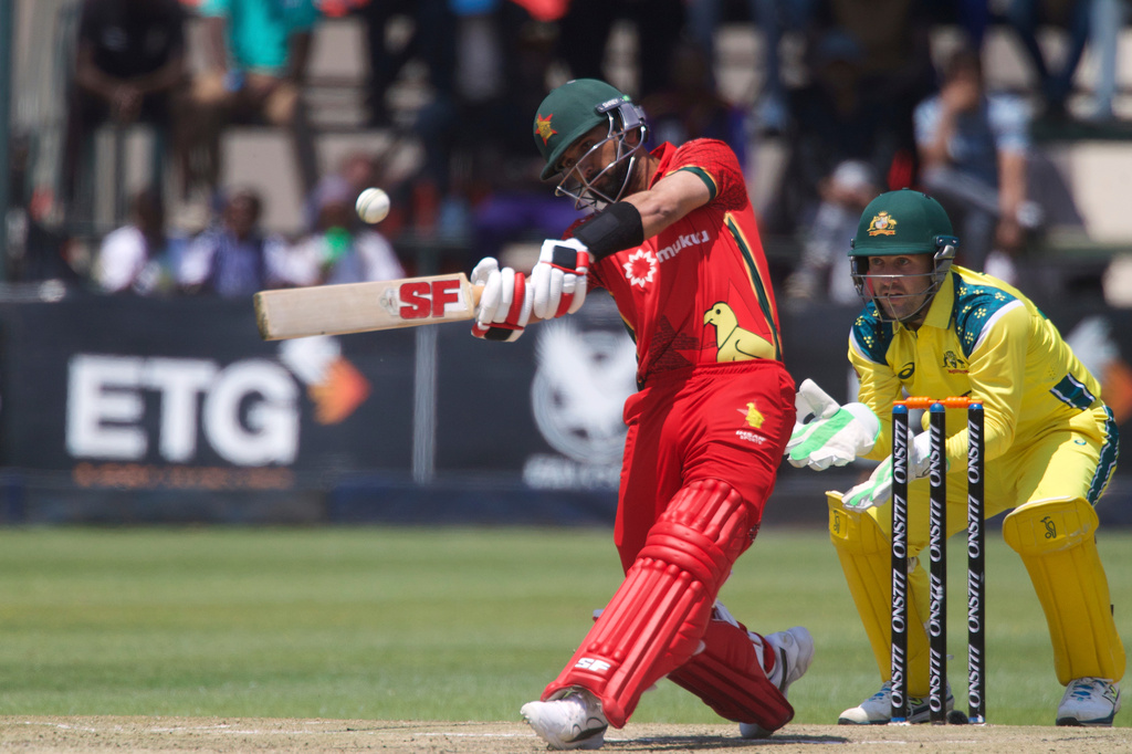 Zimbabwe's captain Sikandar Butt, left, plays a shot whilst Australia's wicketkeeper Josh Inglis watches on during the third one day international cricket match between Zimbabwe and Australia in Harare, Zimbabwe, Sunday, Sept. 20, 2026. (AP Photo/Wonder Mashura)