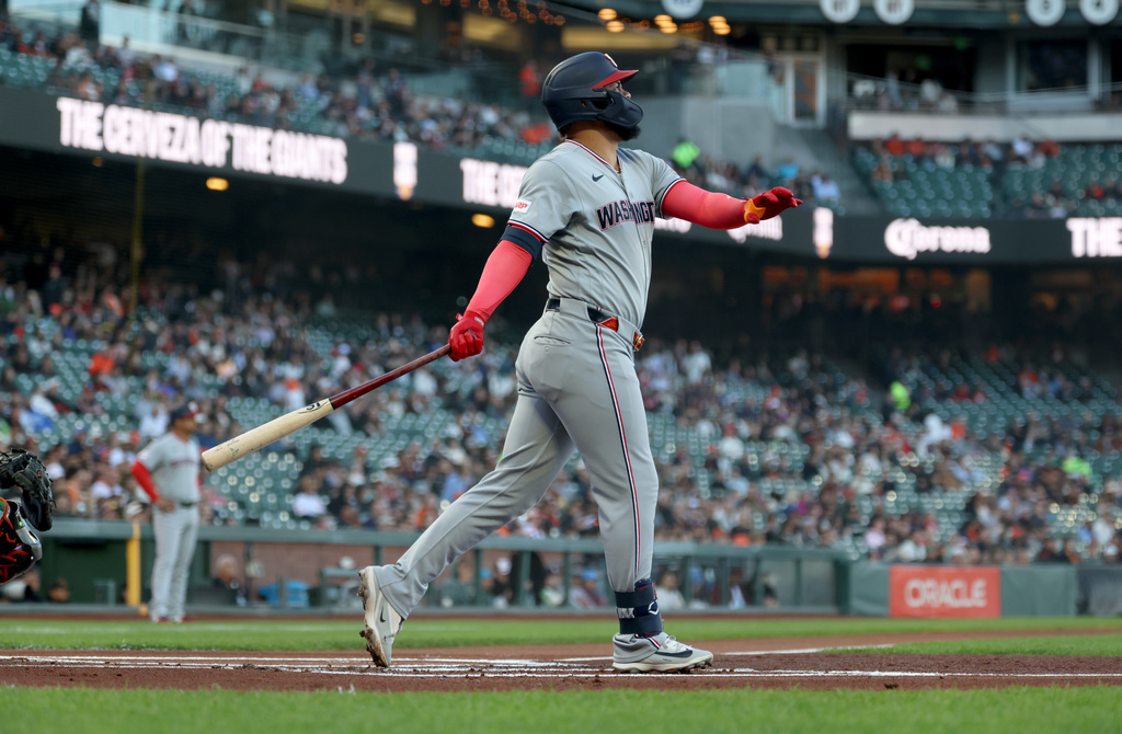 Washington Nationals' Luis García Jr. watches his two-run home run during the first inning of a baseball game against the San Francisco Giants in San Francisco, Tuesday, June 9, 2026. (AP Photo/Jed Jacobsohn)